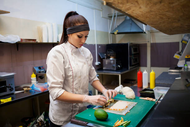 istock female chef preparing a sushi restaurant in the kitchen 905480722
