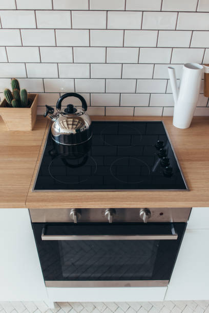 istock Electric oven Modern new light interior of kitchen. 905481080