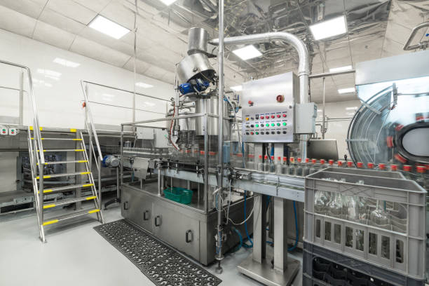 istock The shop for bottling beverages. Automatic filling line 905481458