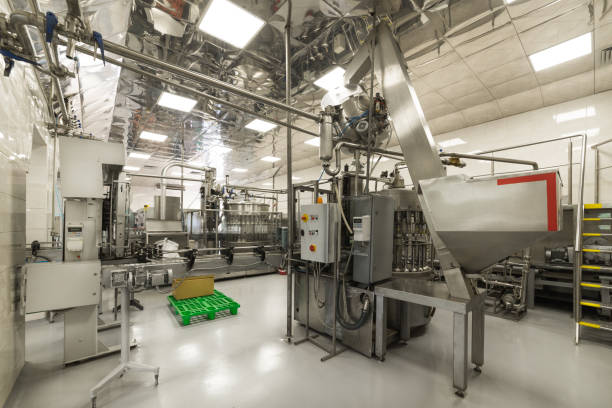 istock The shop for bottling beverages. Automatic filling line 905481520