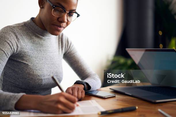 Experienced Afro American Female Owner Of Business Signing Contract With Corporation For Making Rebranding Campaign To Attract Customers Choosing Best Professional Experts In Online Database Stock Photo - Download Image Now