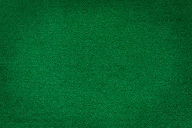 istock Green felt texture for poker and casino. 905484364