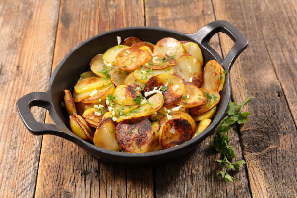istock potato slices cooked with garlic and parsley 905484492