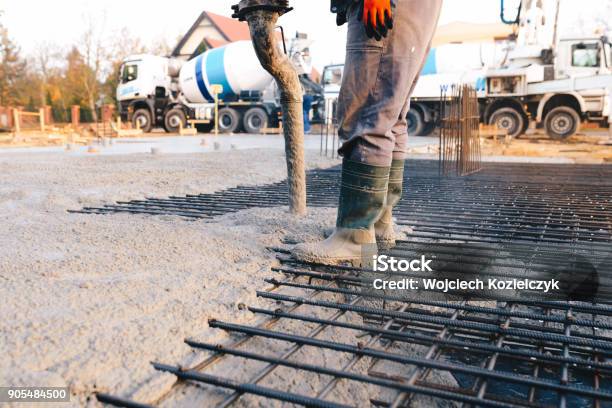 Concrete Pouring During Commercial Concreting Floors Of Buildings In Construction Stock Photo - Download Image Now