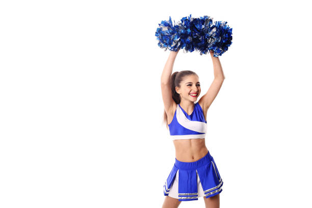 istock Young cheerleader in blue and white suit with pompoms on white background. Isolated on white background. 905488520