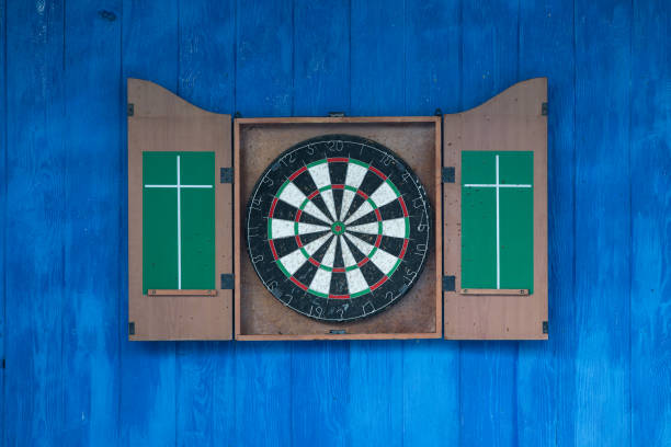 istock darts on a blue wooden wall 905489078
