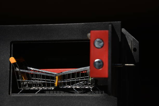 istock Shopping cart in  safe box 905489352