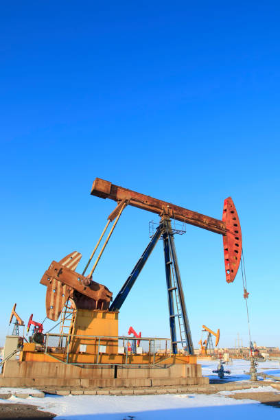 istock Oil field, oil pump in the work 905489850