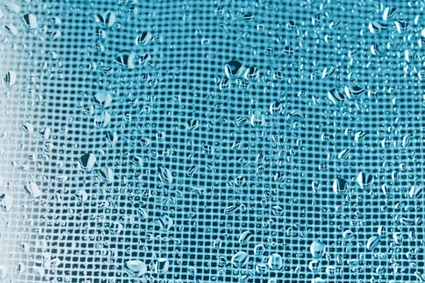 istock Background with drops . Texture Rain drops on the glass. blue background with water drops 905490054