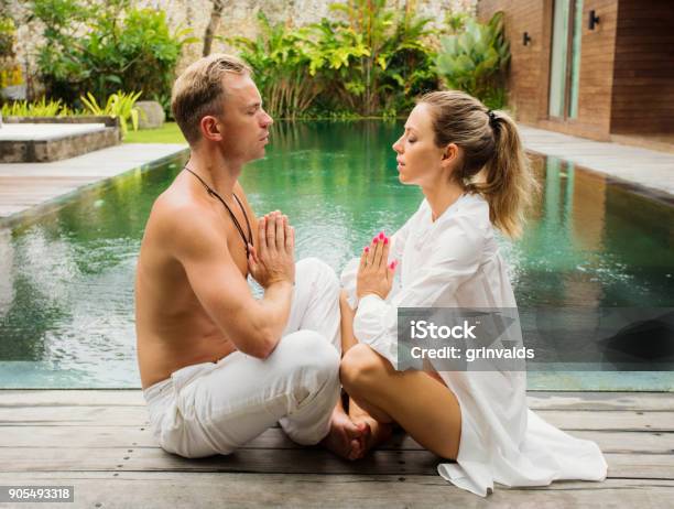 Couple Meditate Together Stock Photo - Download Image Now - Couple - Relationship, Lotus Position, Relaxation