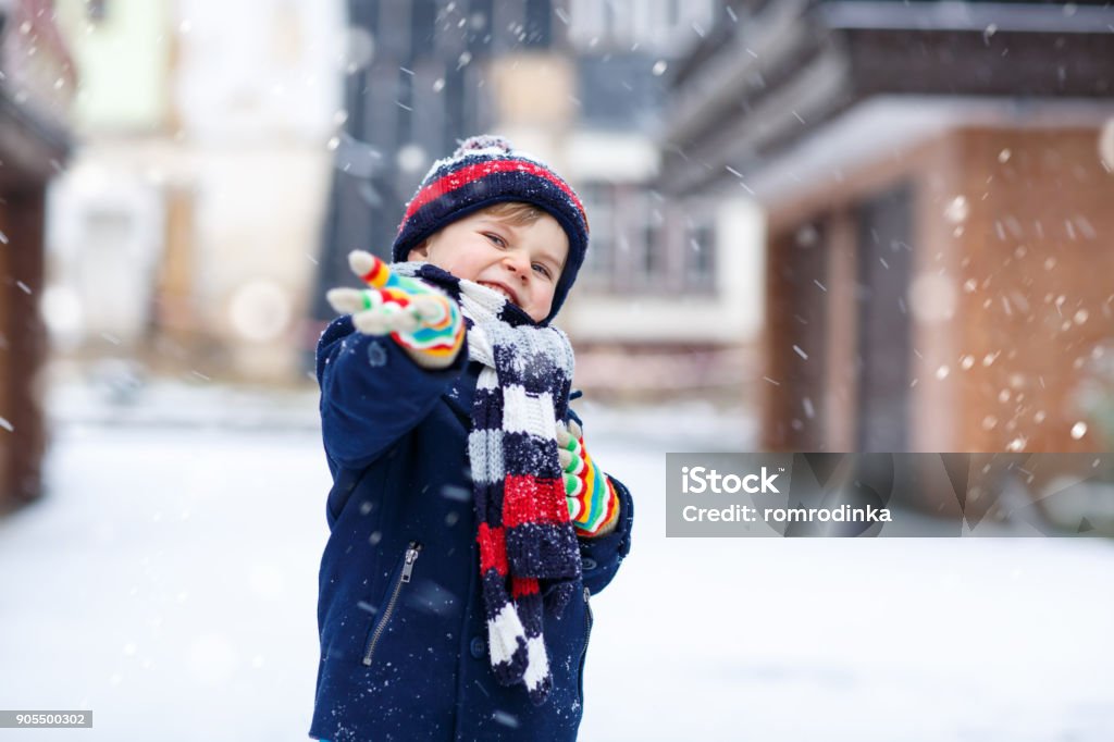 Cute Little Funny Kid Boy In Colorful Winter Fashion Clothes