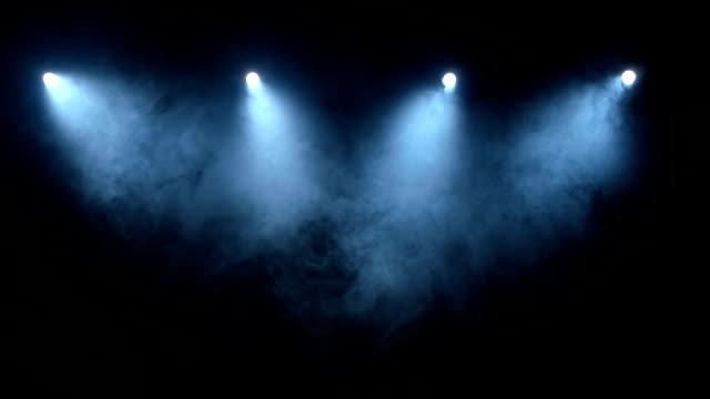 Flow stage of formless smoke swirling against a black background