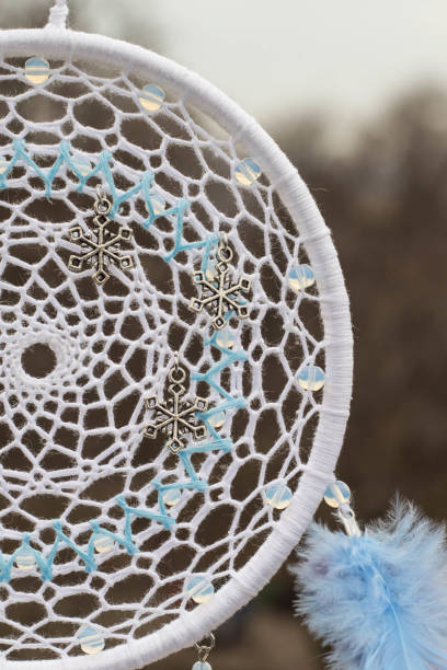 istock Handmade dream catcher with feathers threads and beads rope hanging 905508056