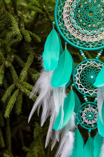 istock Handmade dream catcher with feathers threads and beads rope hanging 905508374