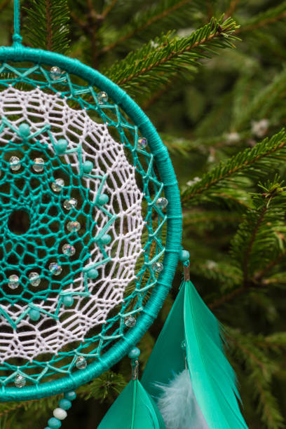 istock Handmade dream catcher with feathers threads and beads rope hanging 905508376