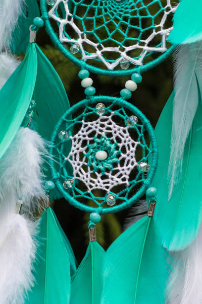 istock Handmade dream catcher with feathers threads and beads rope hanging 905508378