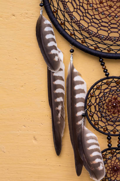 istock Handmade dream catcher with feathers threads and beads rope hanging 905508444
