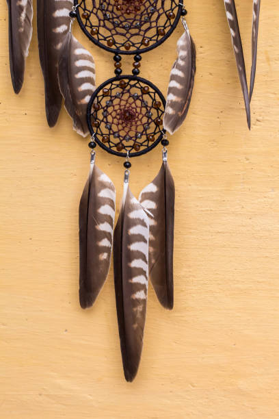 istock Handmade dream catcher with feathers threads and beads rope hanging 905508446