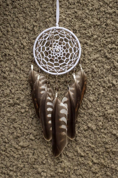 istock Handmade dream catcher with feathers threads and beads rope hanging 905508464