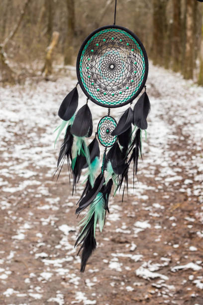 istock Handmade dream catcher with feathers threads and beads rope hanging 905508620