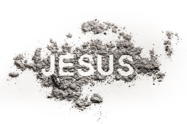 istock Word Jesus written in ash, sand or dust 905509188