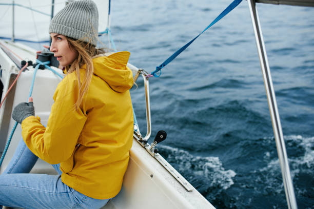istock Young strong woman sailing the boat 905514368