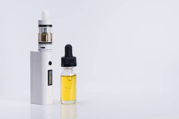 istock electronic cigarette with liquid for vapor on a light background 905514372