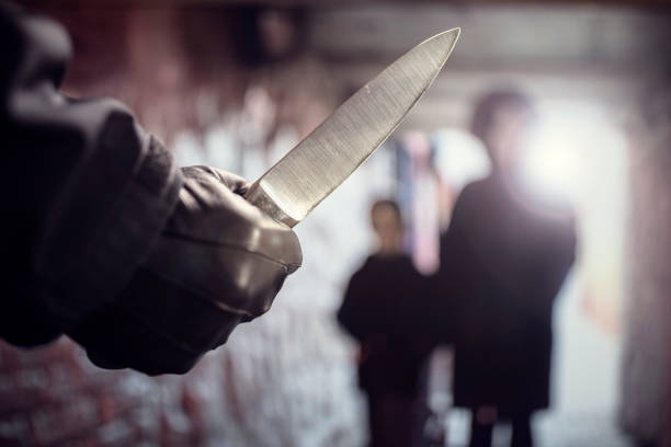 Criminal with knife weapon threatening woman in underpass crime Criminal with knife weapon threatening woman and child in underpass crime knife weapon stock pictures, royalty-free photos & images