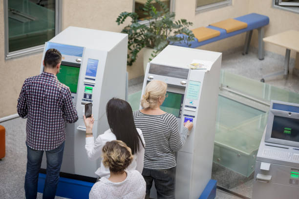 istock People waiting in line for ATM 905515066