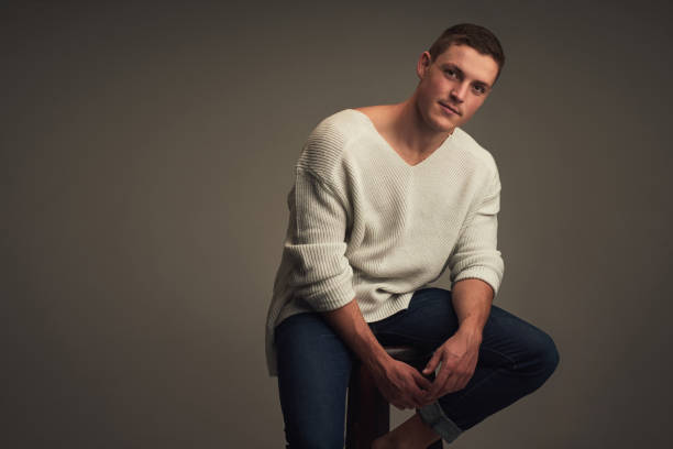 Handsome in style. Young man in casual wear looking at camera