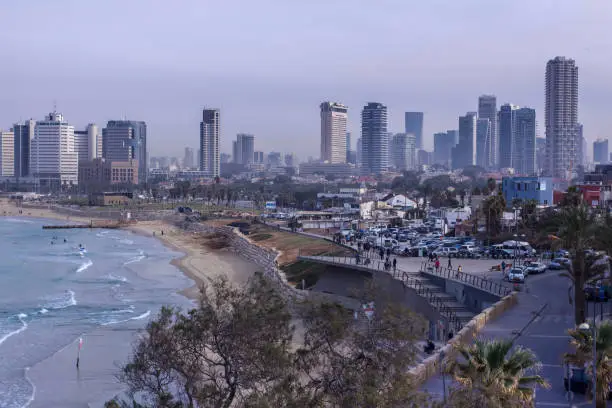 Photo of Tel Aviv beach and city Skyline  in the purple morning mist Israel