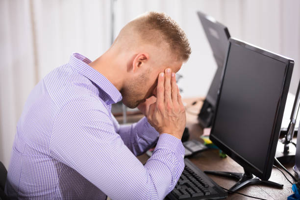 istock Businessman Suffering From Headache 905523934