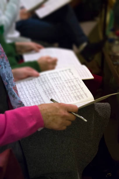 istock Choir singers holding musical score 905530988