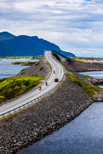 istock Atlantic Ocean Road Two bikers on motorcycles. 905535354