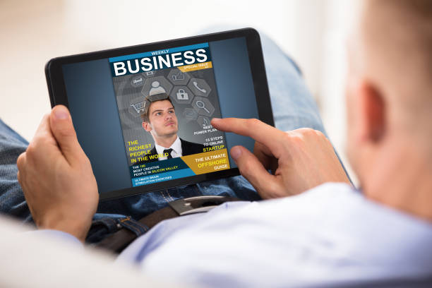 istock Businessman Looking At Business Magazine 905536944