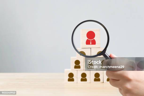 Human Resources Management And Recruitment Business Hiring Concept Hand Held Magnifying Glass Copy Space For Your Text Stock Photo - Download Image Now