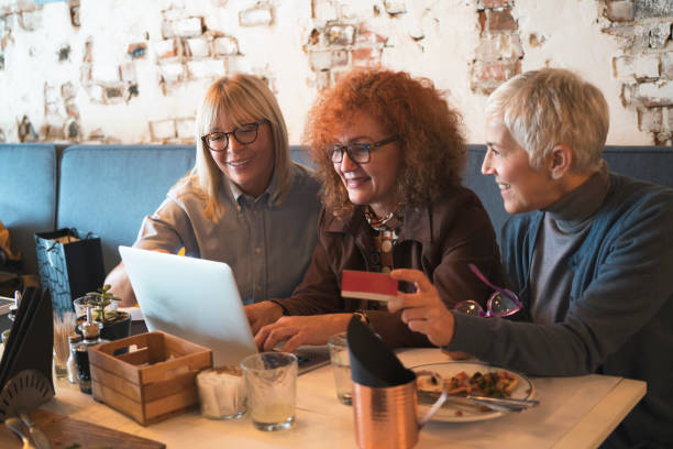 istock Three mature women have a lunch 905552174