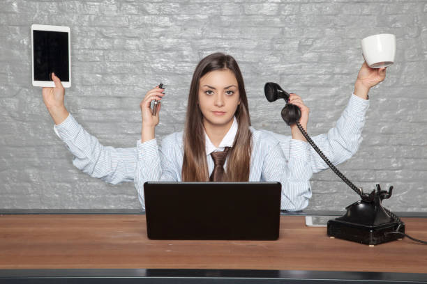 istock self-sufficient business woman works for several people at a time 905552522