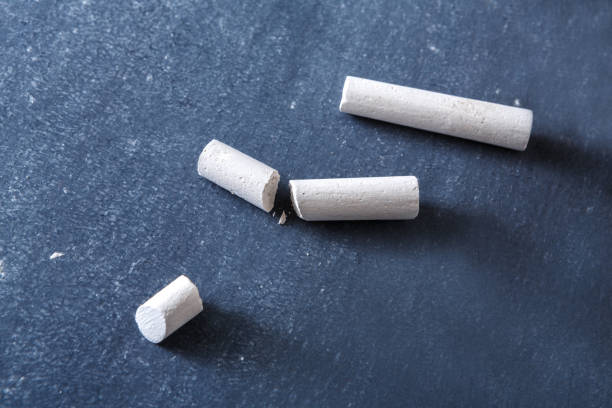Education background, piece of chalk on blackboard