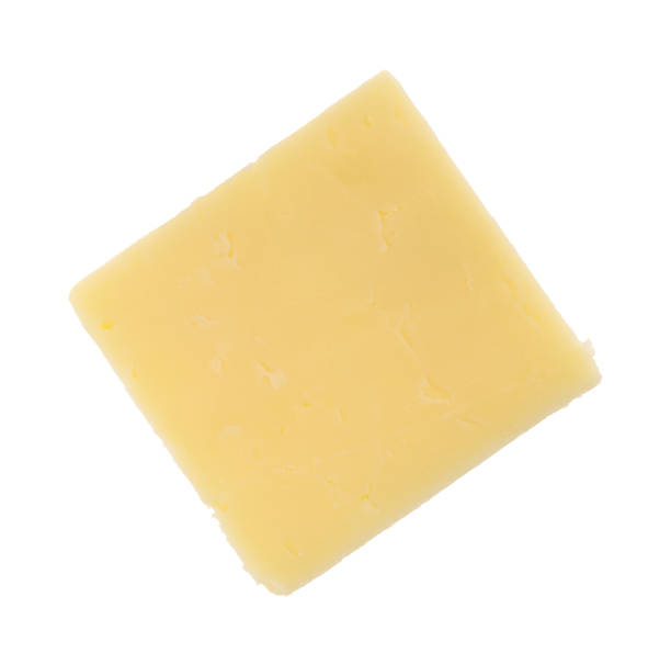 sharp cheddar cheese on a white background - one slice imagens e fotografias de stock