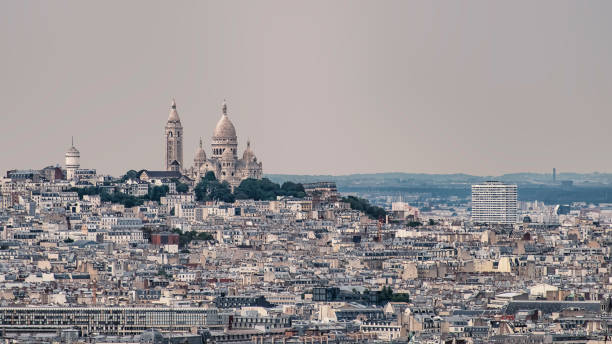 istock Paris city roofs 905560204