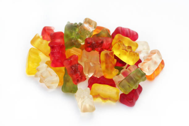istock Colorful fruity Gummy bears on white 905560318