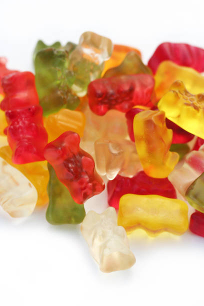 istock Colorful fruity Gummy bears on white 905560342