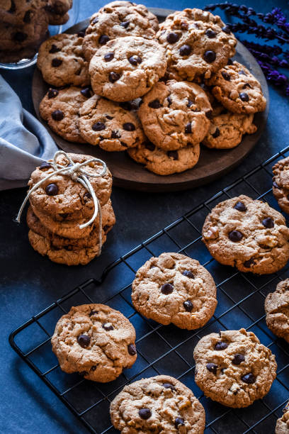 istock Homemade chocolate chip cookies on dark kitchen table 905563690