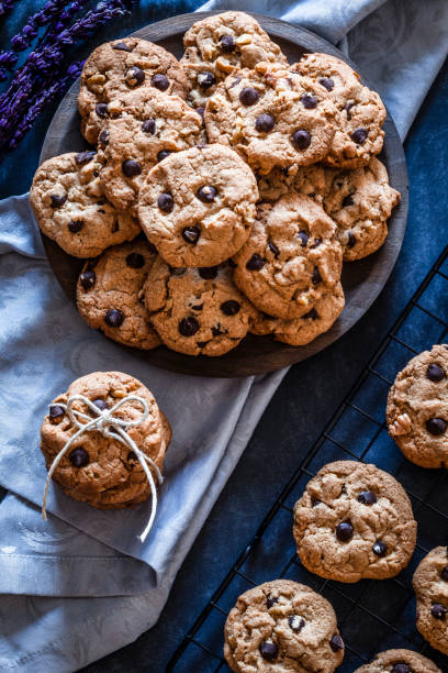 istock Homemade chocolate chip cookies on dark kitchen table 905564330