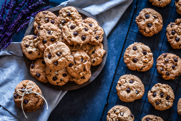 istock Homemade chocolate chip cookies on dark kitchen table 905567584