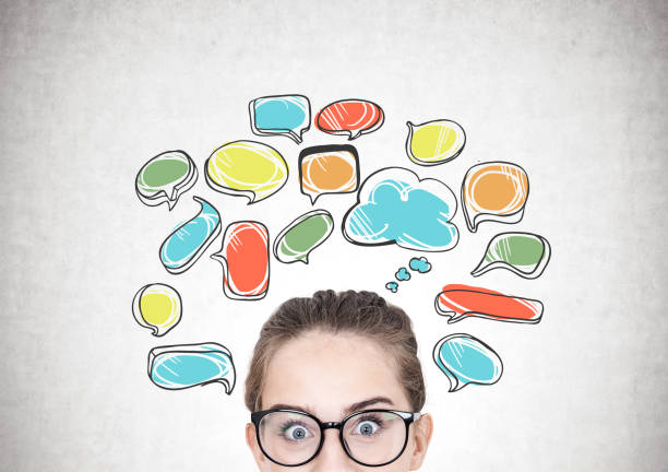 istock Girl in glasses and speech bubbles 905569046