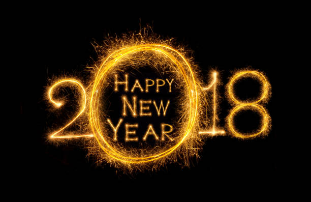 istock Happy new year 2018 written with Sparkle firework on fireworks with dark background, celebration and greeting cards concept 905569406