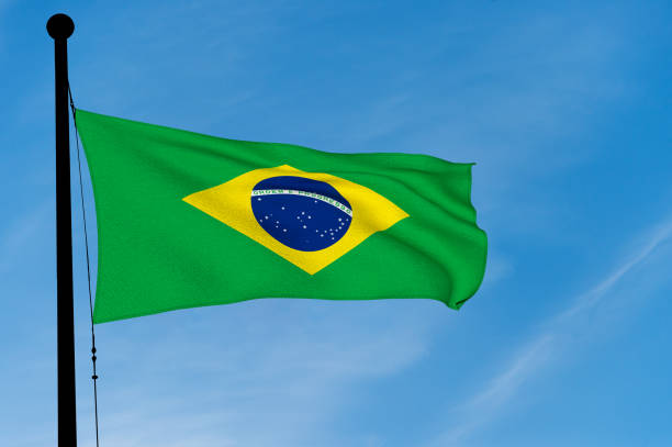 istock Brazil Flag waving over blue sky (digitally generated image) 905575838