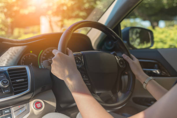 istock young women driving a car 905580522